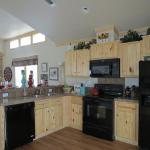 1208 kitchen with 3 window clerestory and blue pondorosa accent wall in LR