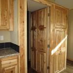 1215 - hidden pantry with hickory cabinets presented by Recreational Resort Cottages and Cabins, Rockwall, Texas. Athensparkhomes.net