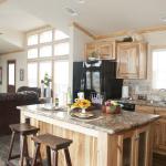 Athens Park Homes Classic 1676C with hickory cabinets on display at Recreational Resort Cottages and Cabins in Rockwall, Texas